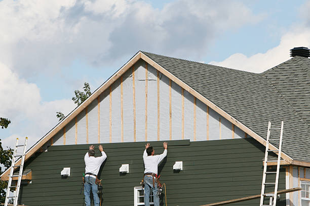 Professional Siding Installation technician working in Cedar Grove, FL
